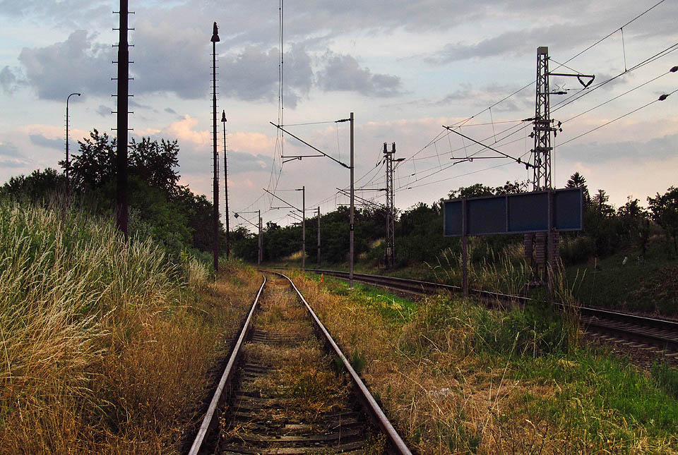 Ze stanice vychází jižním směrem podle trati Brno - Přerov (na fotografii vpravo).